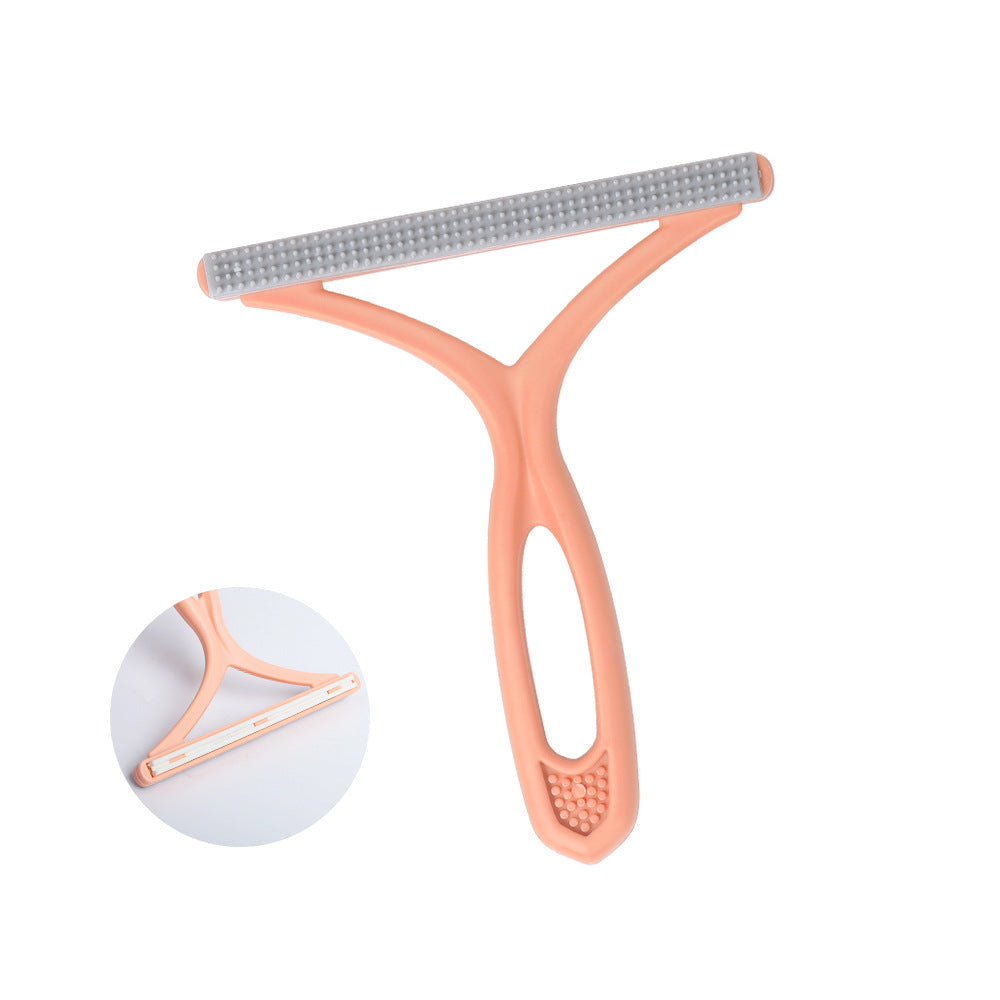 Pet grooming brush with pink handle and gray bristles on a white background